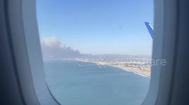 California wildfire smoke seen from plane landing in Los Angeles