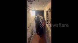 Tourists negotiate grotty alleyway to reach surprisingly clean Airbnb