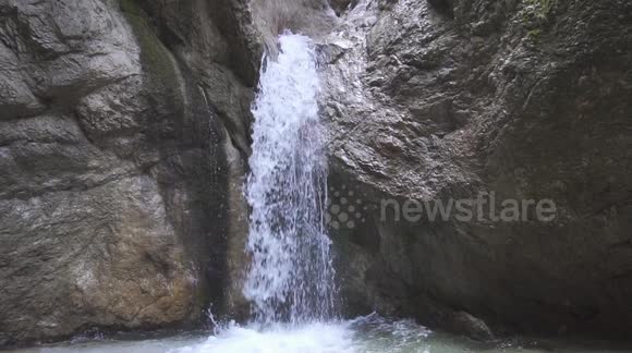 Beautiful and serene waterfall in the middle of the Almbachklamm in Marktschellenberg. Captured in Slow-Motion.