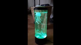 Artificial jellyfish dancing in a liquid lamp in old living room.