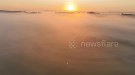 drone footage of Stonehenge in the mist