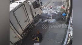 Milkman unloading bottles narrowly avoids being hit by speeding car