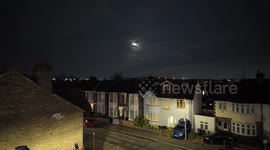 The First Full Moon of 2025 known as the Wolf Moon seen in the very cloudy sky's of East London