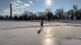 US: Man Enjoys Ice Skating On Frozen Pond At D.C.’s Constitution Gardens
