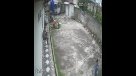 Funny moment, todler kicking father head with ball while playing footbal at home in Tanah Datar, West Sumatra, Indonesia, on January 14, 2025.