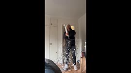 Man holds confetti popper the wrong way and accidentally pops himself