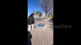 China: A Mistake While Up righting the Fallen Trash Can