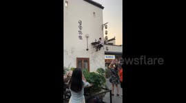 China: Man Reading on the Wall