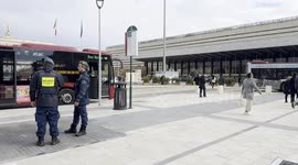 Two security personnel monitor the part of Piazza dei Cinquecento, in front of Termini Station, reopened to the public following the redevelopment works for the Jubilee in Rome.