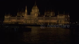 Beautiful nighttime view of the Hungarian Parliament Building in Budapest across the river Danube