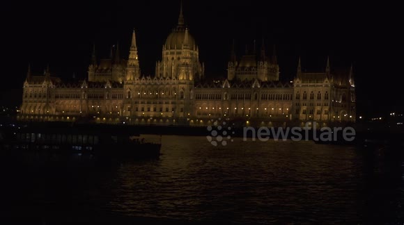 Beautiful nighttime view of the Hungarian Parliament Building in Budapest across the river Danube