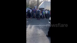 Hero passersby help to lift car to save pedestrian trapped underneath