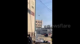 An Israeli army quadcopter drops a bomb on the roof of the Nama Association in the town of Jabalia