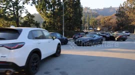 US: Residents escaping L.A. wildfire left their cars behind to flee on foot.