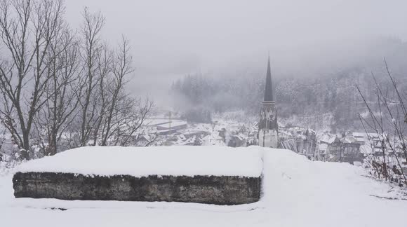 Black Forest Town of Schönau on snowy and misty winter day, captured from above.