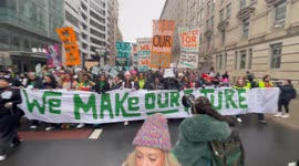 Anti-Trump demonstrators march in Washington, DC ahead of presidential inaugural