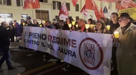 Demonstrators during the torchlight procession of protest against the approval of the Security Decree, the DDL 1660 on public safety, in Rome.