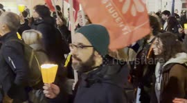 Demonstrators singing 'Bella ciao' during the torchlight procession of protest against the approval of the Security Decree, the DDL 1660 on public safety, in Rome.