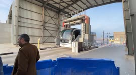 Aid trucks waiting at Rafah crossing start to enter Gaza as ceasefire takes effect