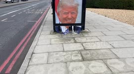 Partially shredded portrait of Donald Trump appears outside the US Embassy in London ahead of the inauguration