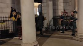 Bagpipes played outside Dover House, Whitehall, London, UK 20/01/2025