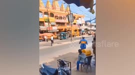 Policeman attacks bystander who was too close to politician's convoy