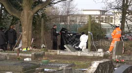 British Transport Police Forensics look for human remains at West Midlands Cemetery in England