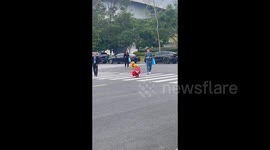 China: A robot dog dressed as a traditional lion for a lion dance