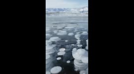 Ice bubble spectacle at Sayram Lake in Xinjiang, China