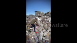 Palestine: Palestinian identifies rubble of his home with personal belongings linked to Al Ahly club