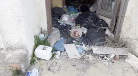 Garbage dumped at the entrance to an abandoned restaurant near the area where Royal Caribbean plans to build the first large privately managed tourist port in Italy in Fiumicino, near Rome.