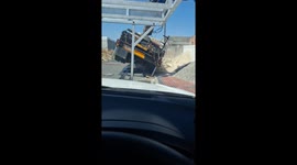 Worker gets flipped off truck and tries to turn fall into a smooth improvised act
