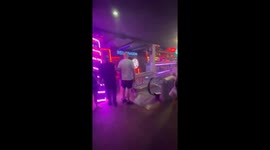 Panic at the gogo! Tourists and half-naked strippers flee into street as fire hits strip clubs