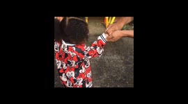 Daughter holds a Cricket bug for the first time