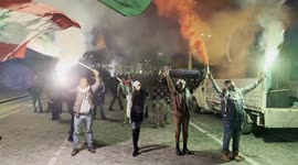 Israel-Hamas war: Protesters hold smoke bombs and wave Palestinian and Lebanese flags during the Palestine support rally ahead of Remembrance Day in Rome.