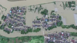 Aerial footage of floods swamping villages in southern China