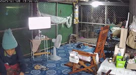 Candid CCTV captures grandfather tucking pet dog in bed at night