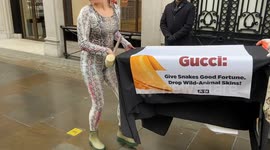 PETA activists shock passers-by outside Gucci in London with horrific “dead snake” stunt