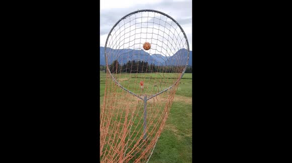 Perfect final Footgolf Goal before backdrop of the German Alps.