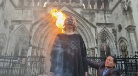 Activists in 'Scold's Bridals' create apocalyptic scene outside the Royal Courts as first day of climate protesters' appeal gets underway