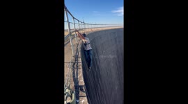 Fearless climber hangs one-handed from nuclear cooling tower in Sacramento