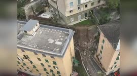 Firemen search for survivors from wall collapse in Italy