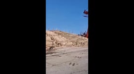 Cargo ship tilts, spilling thousands of logs into the sea in Primorsky, Russia