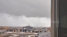 Rare landspout tornado forms during snowfall in Albuquerque, New Mexico, USA