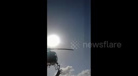 Police Helicopter Cooperates With Posing Tourists