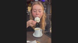 Woman's attempt to eat a giant scoop of whipped cream ends in a hilarious mess
