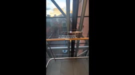 Woman takes ride in descending lift where music plays in reverse creating fascinating experience