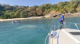 Captain Calamity! British tourists rescued when dinghy they took out sea fishing conks out off Thai coast