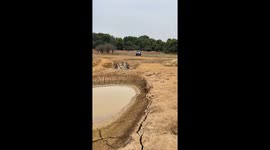 Off-road vehicle fails to cross mud pit in Jiangxi, China