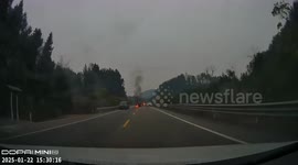 Passing drivers rescue motorist engulfed in flames from car crash in China